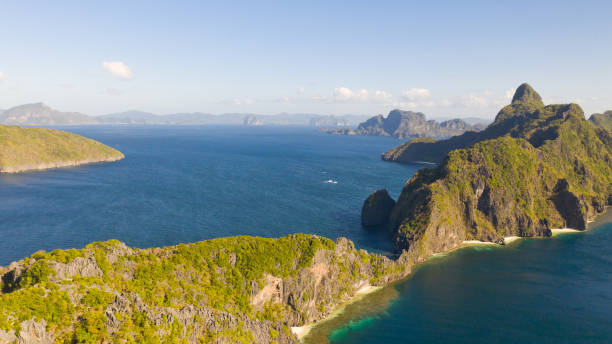 istock Seascape with tropical islands. Rocky islands with white beaches 1158996004