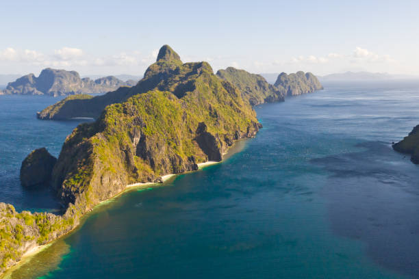 istock Seascape with tropical islands. Rocky islands with white beaches 1158996010
