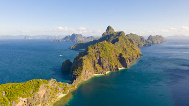 istock Seascape with tropical islands. Rocky islands with white beaches 1158996140