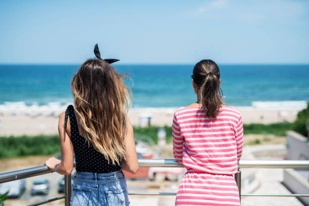 istock Females relaxing and drinking coffee on summer vacation. 1158996284