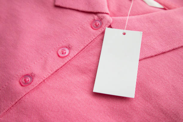 istock Blank white clothes tag label on new shirt 1158997270