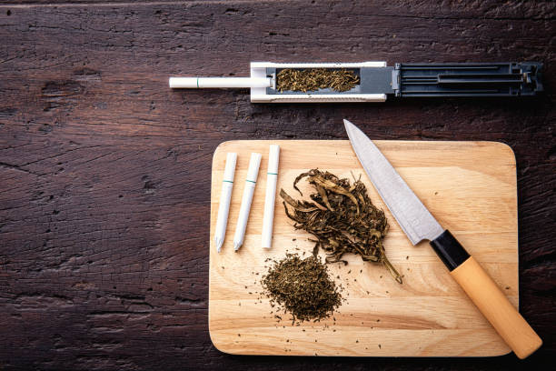 Marijuana, scales, jambs , grinder, medical cannabis oil CBD. Drugs narcotic concept. stock photo
