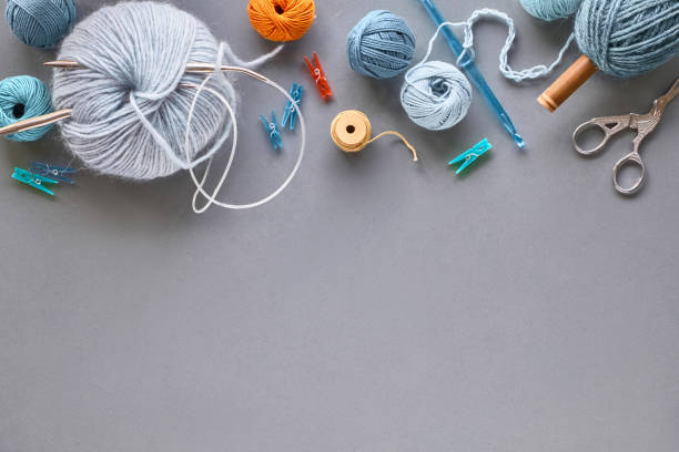 istock Various wool yarn and knitting needles, creative knitting hobby background with text space 1159002977