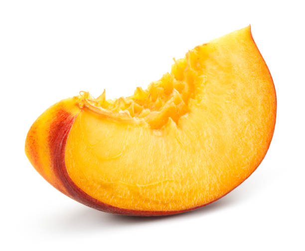 istock Peach slice on white background. Sliced peach isolated. 1159003954
