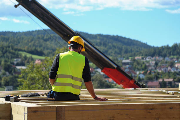 istock Worker on a wooden house frame taking a break 1159004122