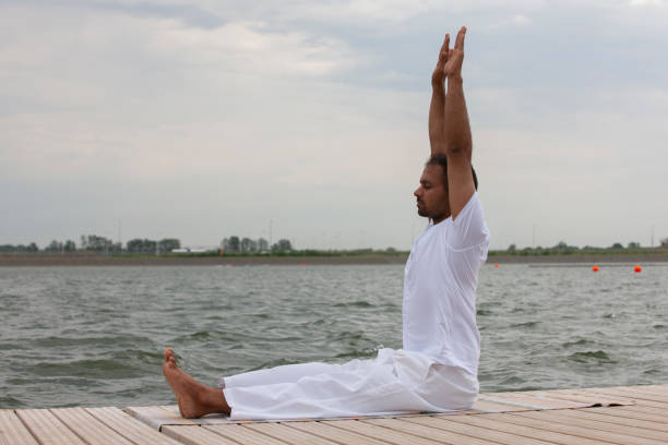 istock Man doing yoga exercise in the morning. 1159004358
