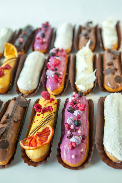 istock Set of several eclairs with various fillings and design isolate on a white background, the concept of French cuisine 1159004981