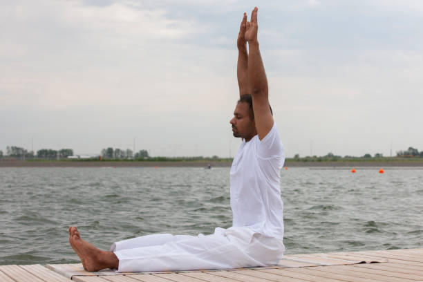 istock Man doing yoga exercise in the morning. 1159005430