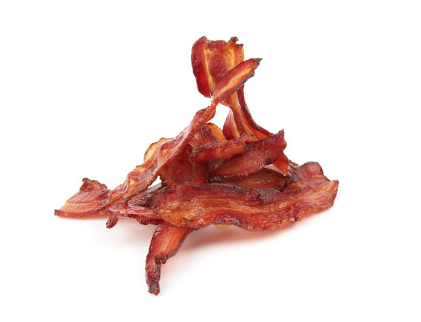 cooked slices of bacon cooked slices of bacon isolated on white background cooked bacon slice stock pictures, royalty-free photos & images