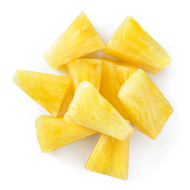 istock Canned pineapple chunks. Pineapple slices isolated. Pineapple top view. 1159007448