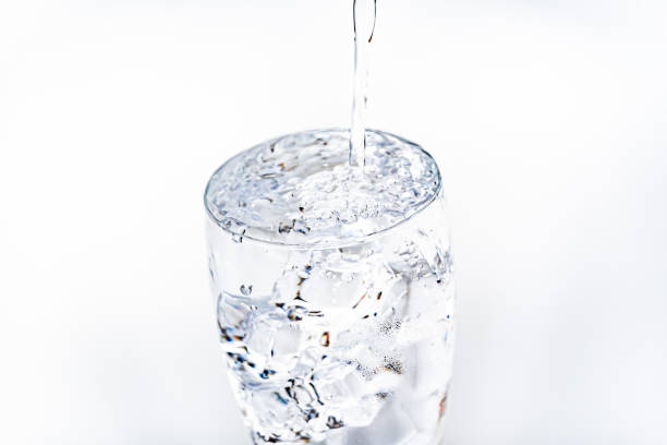 Pouring water into a glass