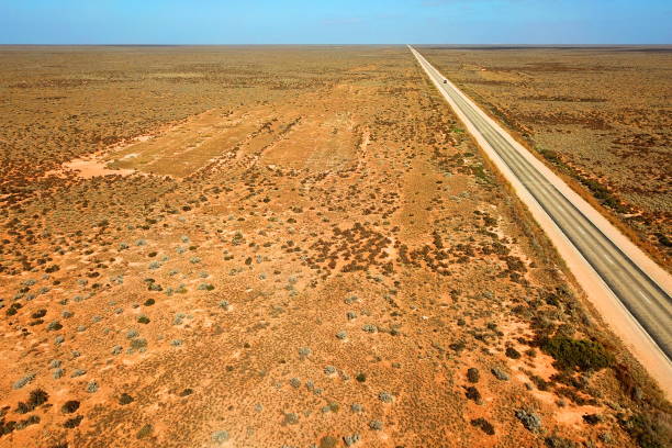 istock Tracks across Australian desert 1159011710