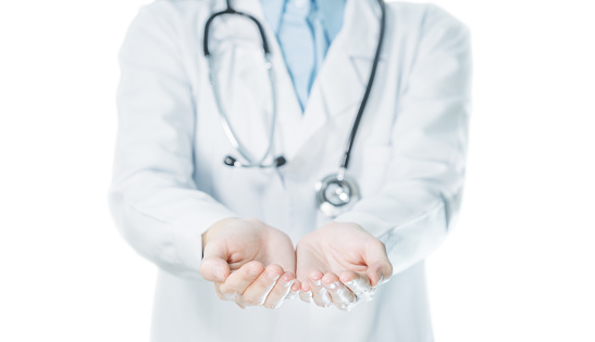 Doctor show empty palm hand gesture for holding, giving, receive and protection.