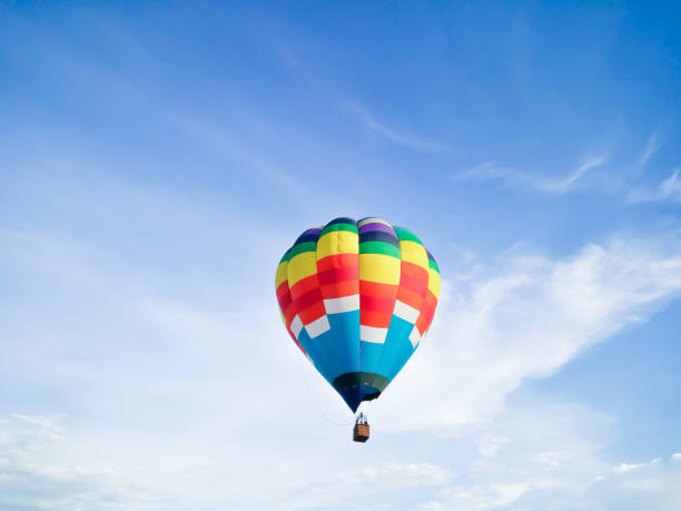 istock Hot air balloon in Flight with blue sky background 1159016393