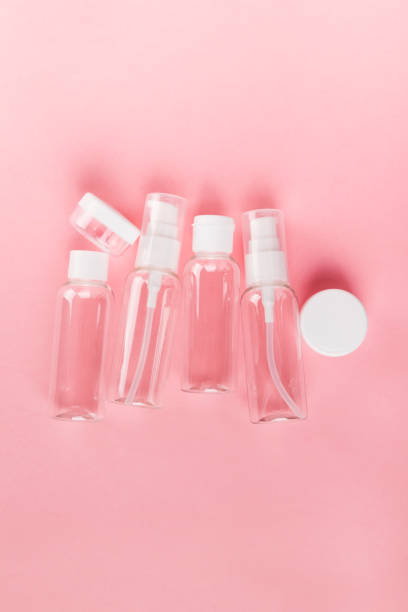 istock Travel small bottle set on a pink background. Top view 1159019202