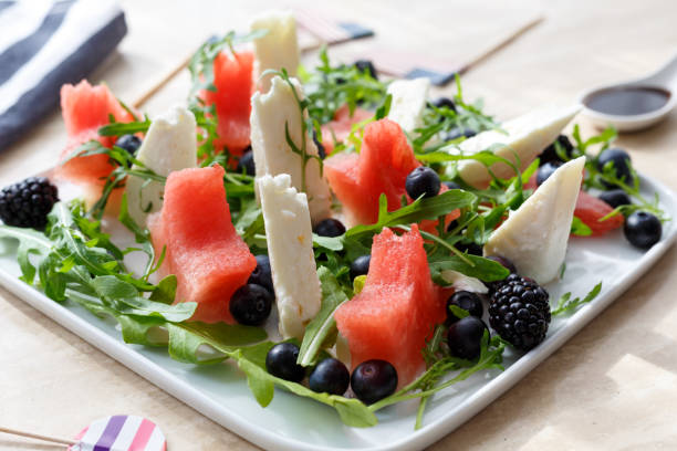 istock appetizer with watermelon, cheese, arugula and berries 1159020093