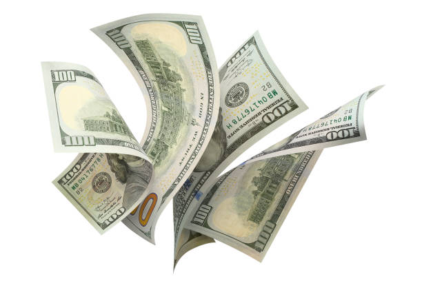 istock Flying 100 American dollars banknotes on white 1159021096
