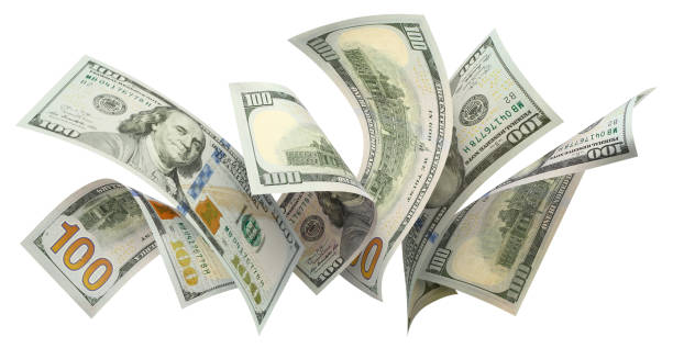 istock Flying 100 American dollars banknotes on white 1159021125