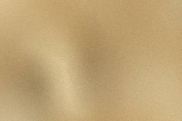 istock Glowing light brown brushed metal wall, abstract texture background 1159021503