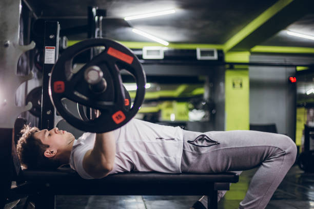 istock Weightlifter or bodybuilder lifting weights 1159024772