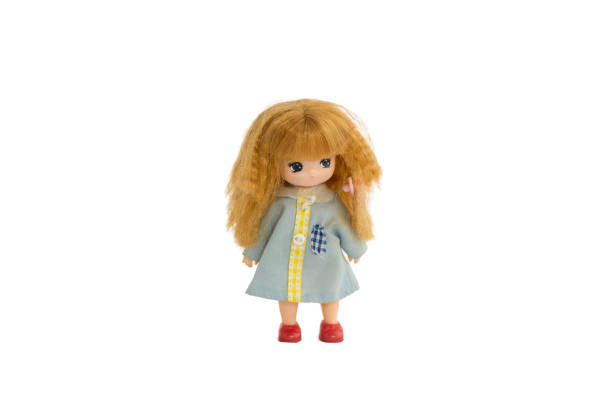 istock girl doll on white background 1159024900