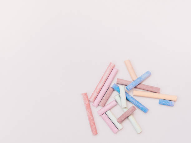 istock Multicolored pieces of chalk isolated on white 1159025169