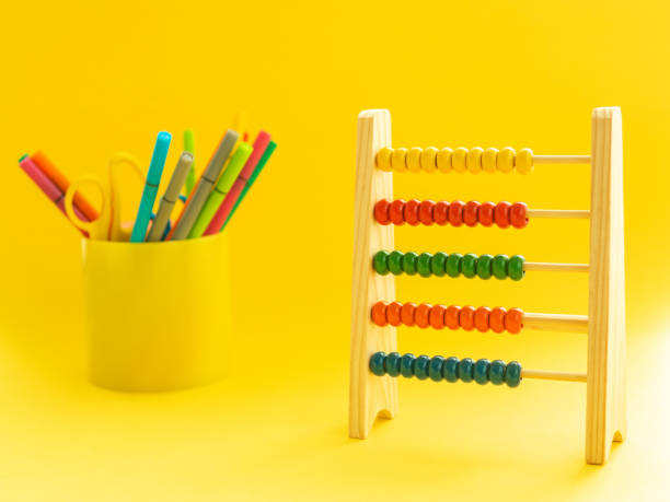 istock Back to school concept. Multicolored markers in a cup and calculator, 1159025174
