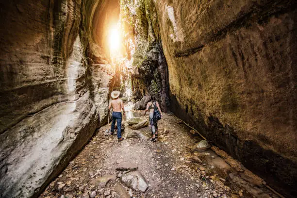 Photo of Hipster couple exploring a beautiful canyon on Cyprus island.