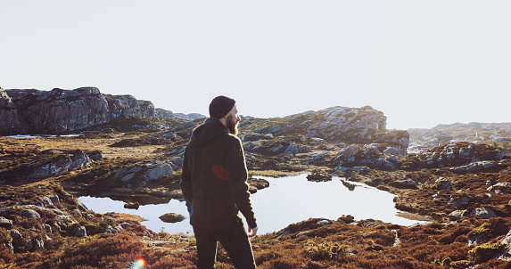 Man travel adventures: mountain hiking in Norway