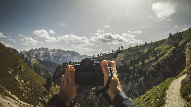 POV photographing the Dolomites with digital camera
