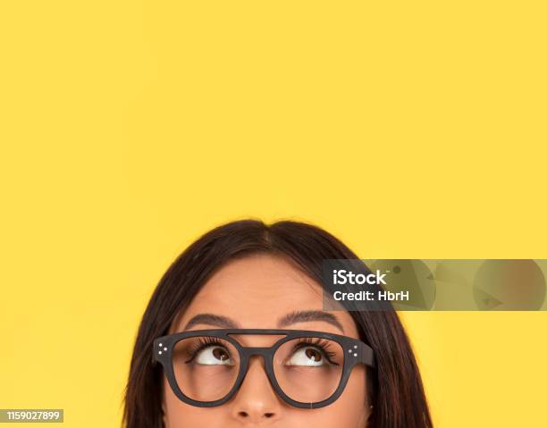 Closeup Portrait Headshot Cute Happy Woman In Glasses Looking Up Stock Photo - Download Image Now