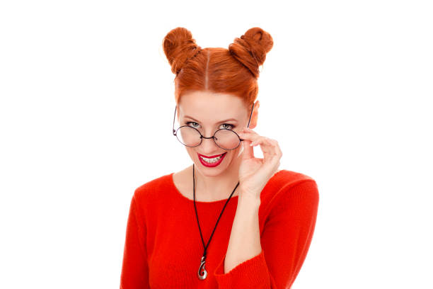 istock woman in her 30s touching holding eyeglasses smiling 1159028268