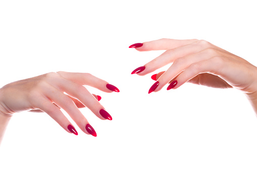 Bright festive red manicure on female hands. Nails design.