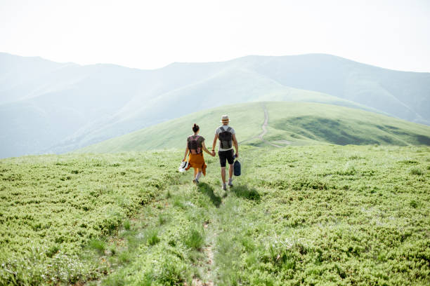 istock Couple traveling in the mountains 1159032341