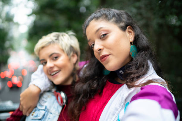 istock Latin friends taking a selfie in the park 1159033503