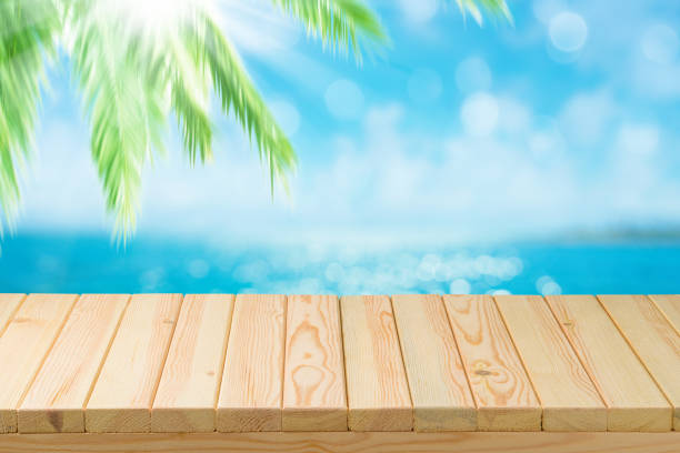 istock Empty wooden table over sea background. Summer holiday vacation concept 1159034082