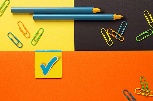 A mockup of images of office supplies. Back to school, September 1. Place for text. Background multicolor. Selective focus, copy space, top view, flat lay.