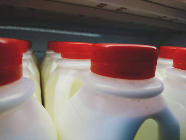 istock Milk in plastic bottles with red caps