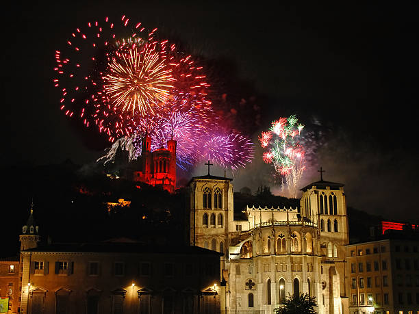 fireworks Colorful fireworks sparkle over the basilica (Fourviere) and the cathedral (St Jean) in the city of Lyon (France)  fourviere stock pictures, royalty-free photos & images