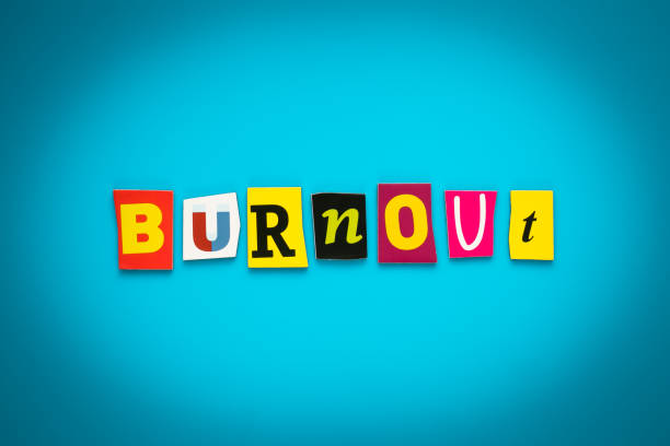 istock Text - burnout from colorful letters on a blue background. Single word. Headline, card with inscription. Psychologic concept, stressful. Caption, heading. Message on poster. 1159036692