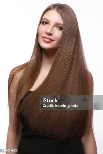 Beautiful Brownhaired Girl In Move With A Perfectly Smooth Hair And Classic  Makeup Stock Photo - Download Image Now - iStock