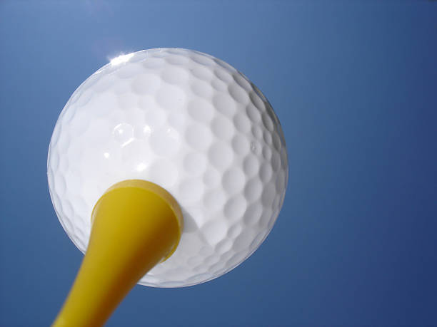 istock Golf Ball on Yellow Tee in Sun 115903813