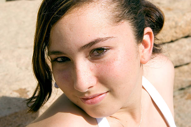 A very pretty young woman looks to the future and contemplates her life.