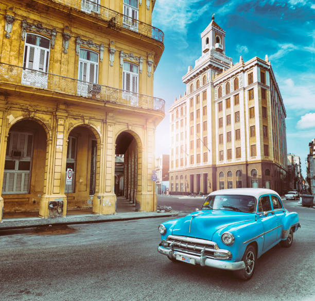 Vintage blue oldtimer car driving through Old Havana Cuba