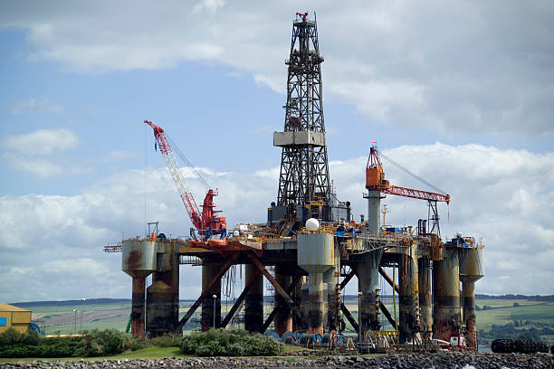 Tabletop shot with homemade model of a drilling platform and two flints