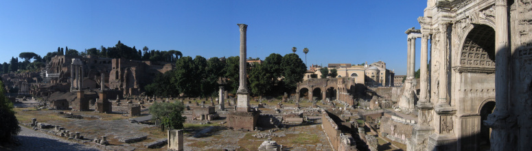 Panorama of the ancient Roman Forum taken in the early morning, before it is open to visitors.  It includes the Arch of Septimus Severus on the right, the columns of the Temple of Saturn behind it and the Temple of Castor and Pollux in the centre.