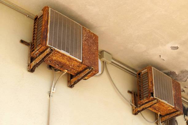 istock Old rusty air conditioner requiring repair or replacement outdoor unit. An example of the influence of sea air on climate equipment. 1159047532