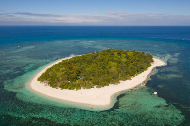istock Mantigue Island, Philippines.Small round island with a white sandy beach 1159047577