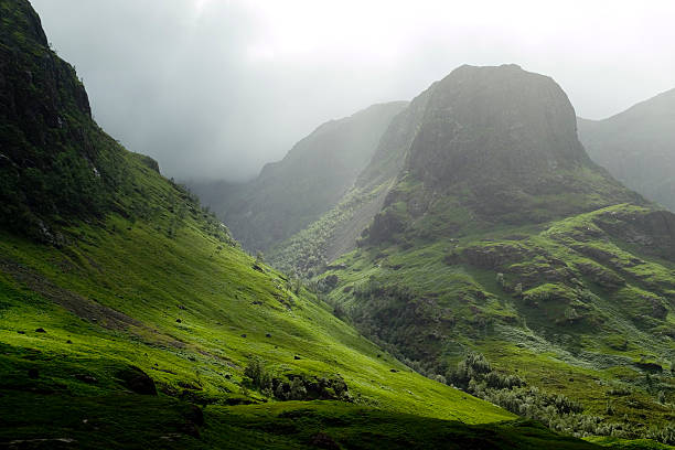 Glencoe pass on a misty day The Glencoe pass on a misty day site of the historic massacre. scottish highlands stock pictures, royalty-free photos & images