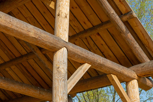 istock sloping roof rustic building round beam on a blue sky background natural material 1159052038